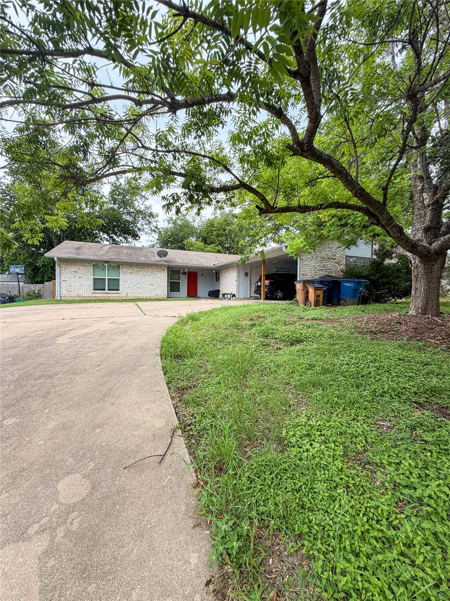 911 Kirschner Place, Unit A Austin, TX 78758 - Photo 1 of 12 A classic brick exterior with a vibrant red door welcomes you home.