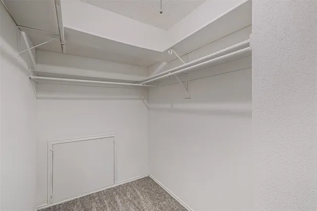 a view of storage and utility room with empty racks