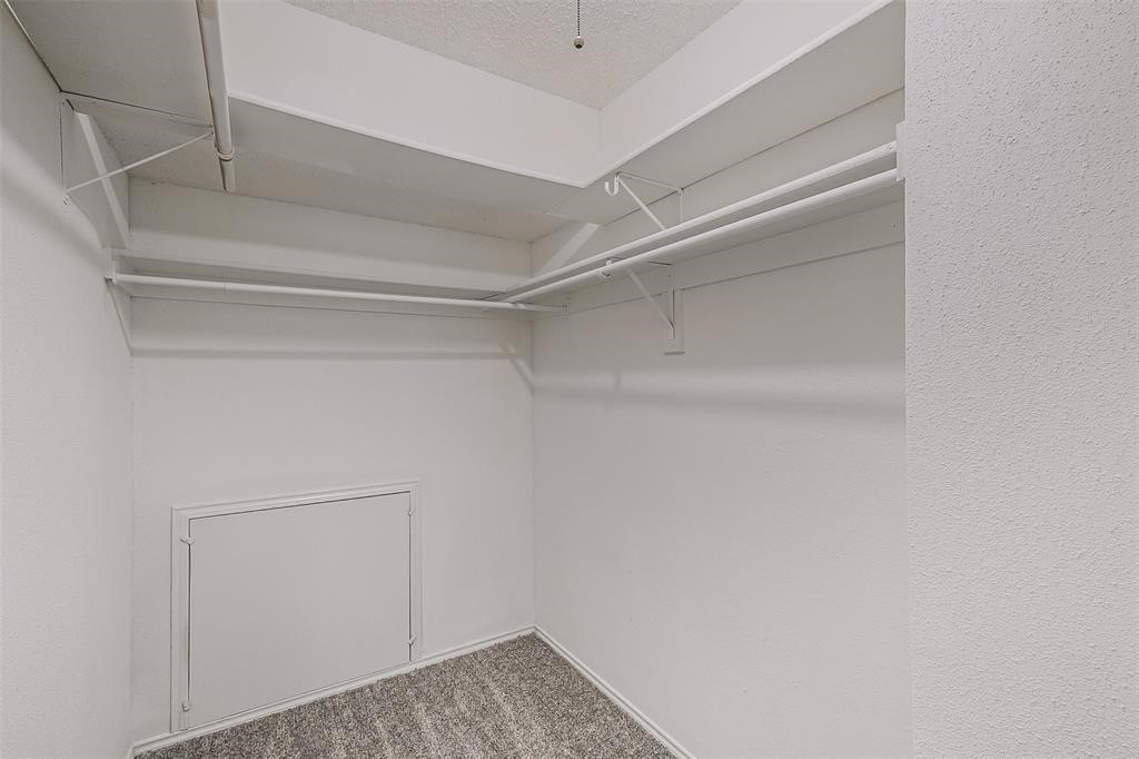 6235 West Willow Bluff Road Katy, TX 77449 - Photo 13 of 18 a view of storage and utility room with empty racks