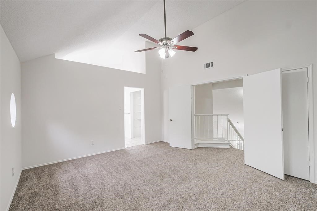 6235 West Willow Bluff Road Katy, TX 77449 - Photo 15 of 18 a view of an empty room with a ceiling fan