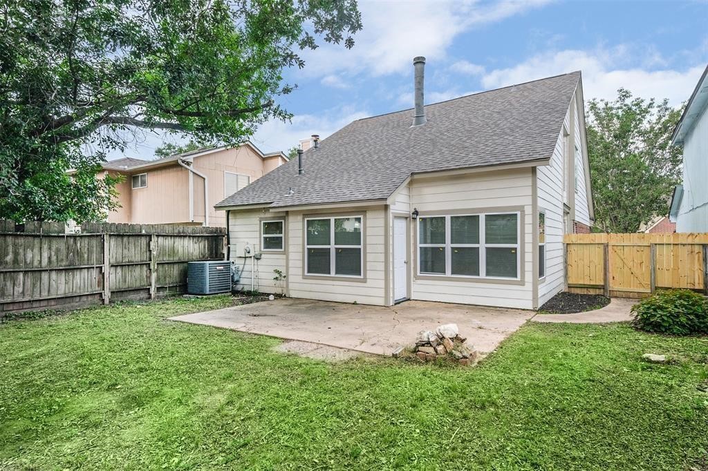 6235 West Willow Bluff Road Katy, TX 77449 - Photo 18 of 18 a view of a house with a yard and sitting area