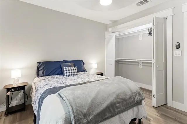 a bedroom with a bed and a closet