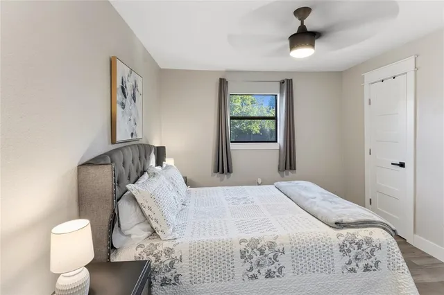 a bedroom with a bed and a window