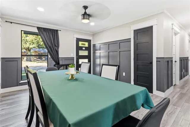 a view of a dining room with furniture and window