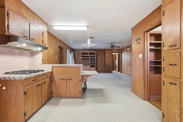 a kitchen with a stove and a refrigerator