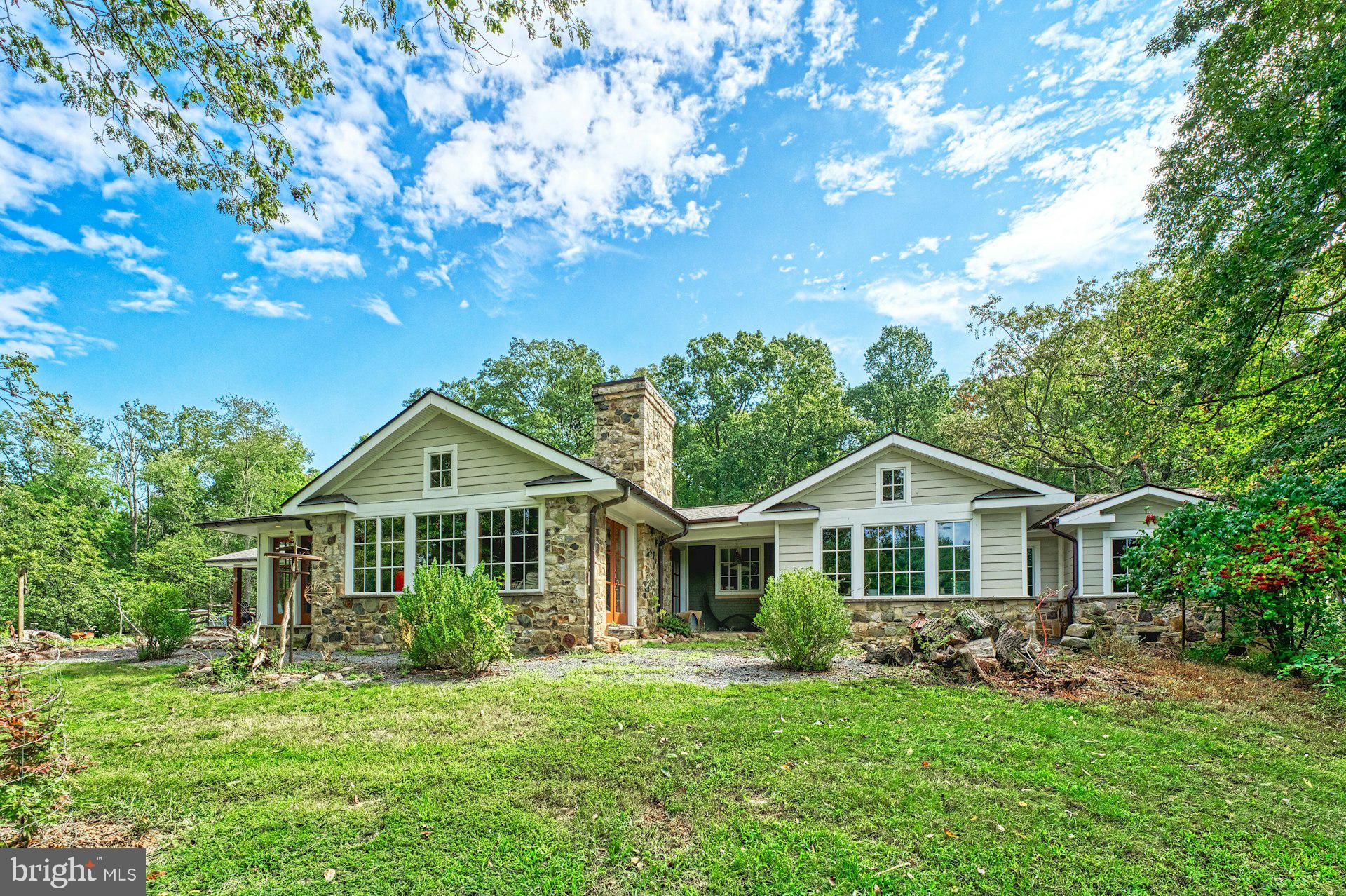43470 Evans Pond Road Leesburg, VA 20176 - Photo 1 of 114 a front view of a house with a yard