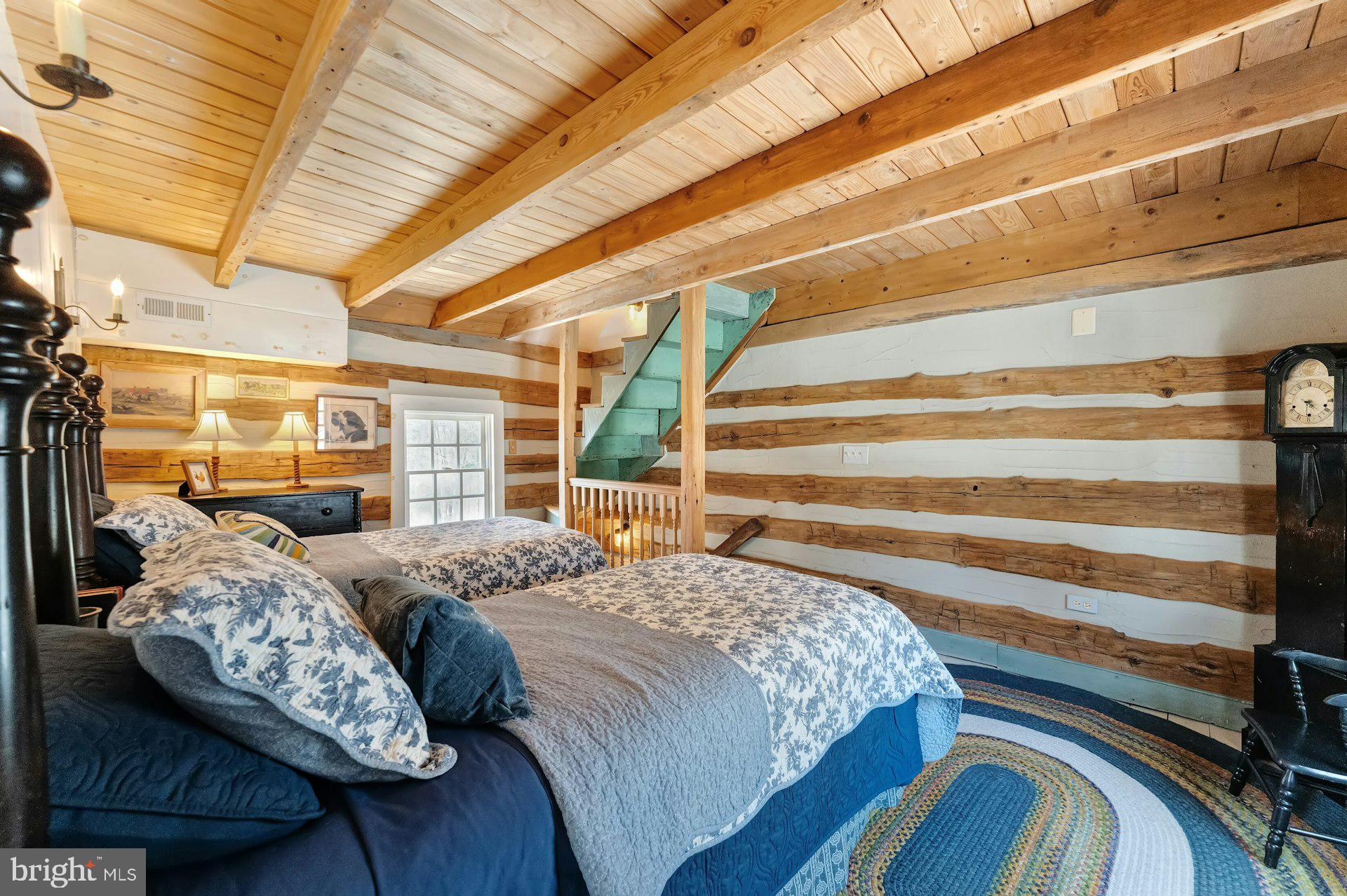 43470 Evans Pond Road Leesburg, VA 20176 - Photo 112 of 114 a bed sitting in a bedroom next to a window