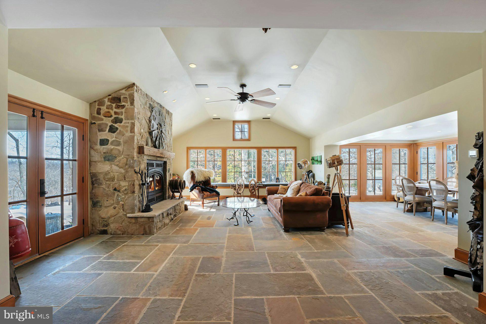 43470 Evans Pond Road Leesburg, VA 20176 - Photo 12 of 114 a living room with patio furniture and a chandelier