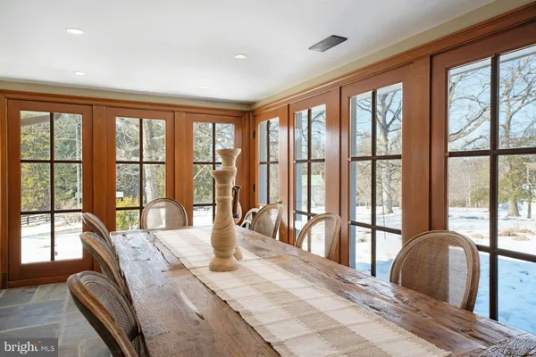 a workspace with furniture window and wooden floor