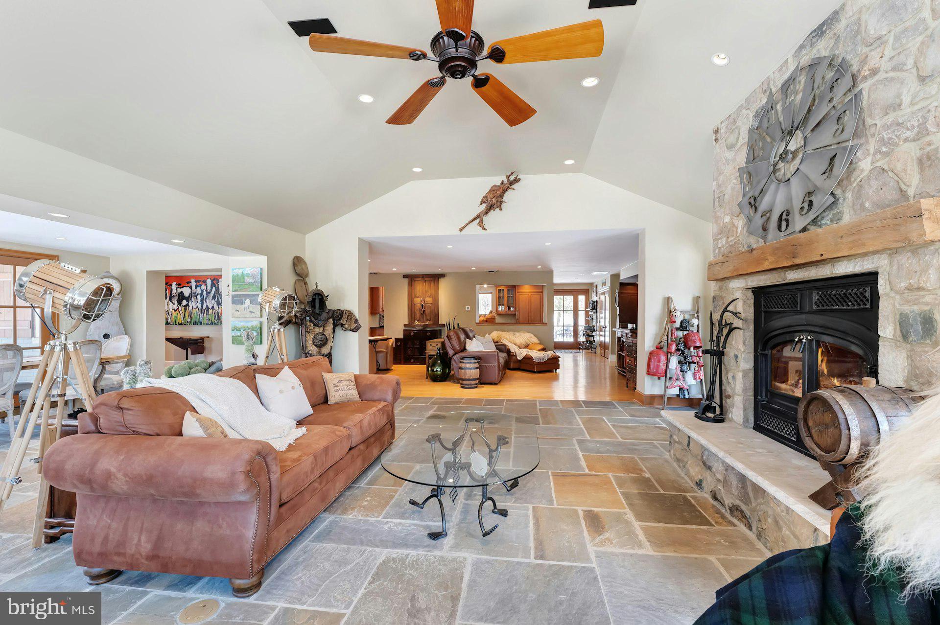43470 Evans Pond Road Leesburg, VA 20176 - Photo 20 of 114 a living room with furniture a fireplace and a chandelier