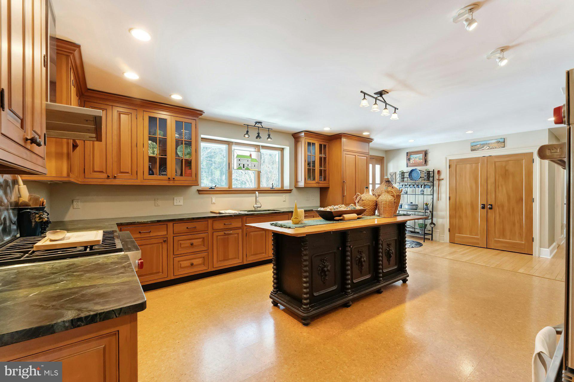 43470 Evans Pond Road Leesburg, VA 20176 - Photo 22 of 114 a large kitchen with stainless steel appliances granite countertop a stove and a sink