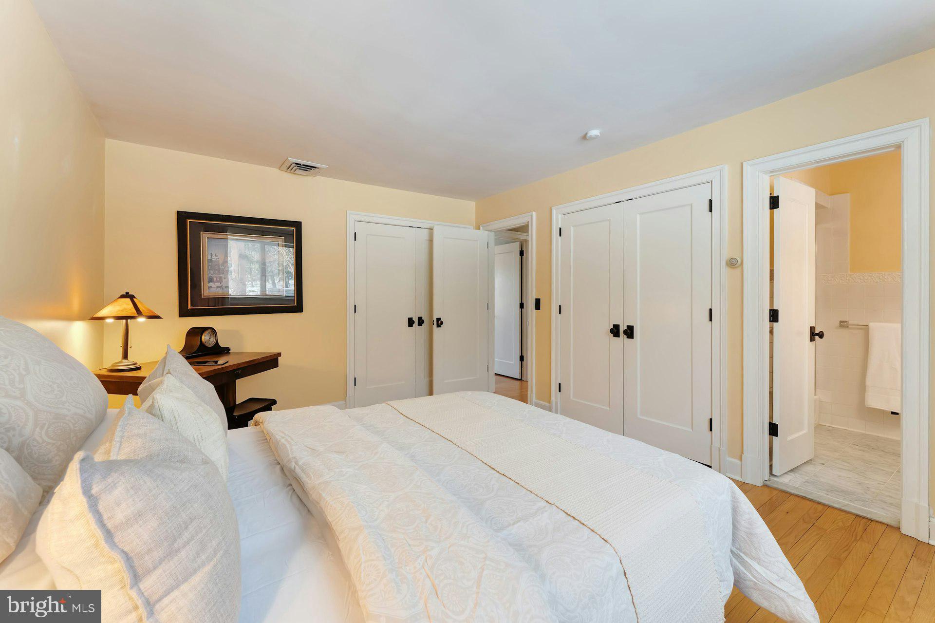 43470 Evans Pond Road Leesburg, VA 20176 - Photo 39 of 114 a bedroom with a bed and a mirror