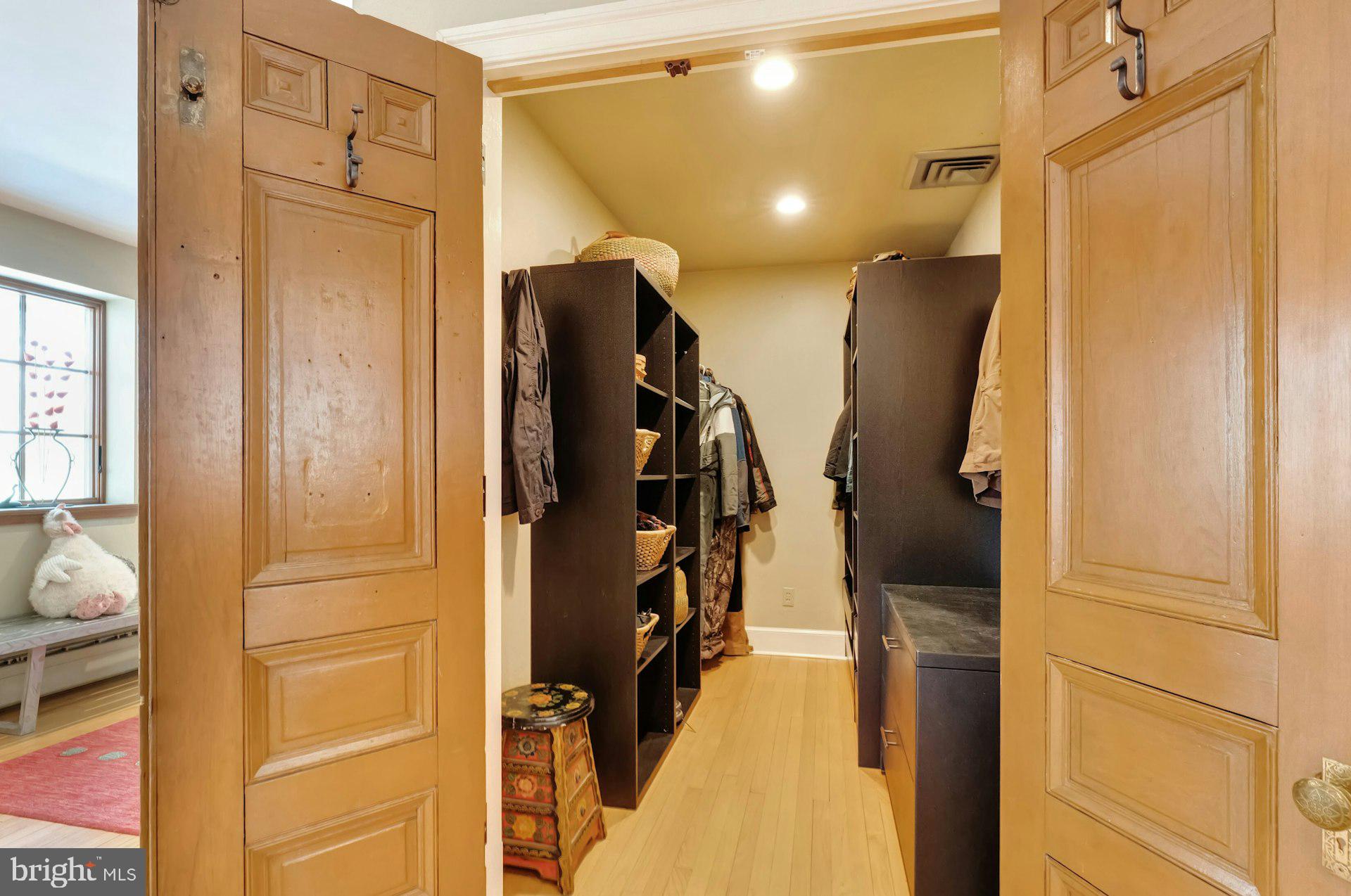 43470 Evans Pond Road Leesburg, VA 20176 - Photo 45 of 114 a view of walk in closet with clothes and shoes