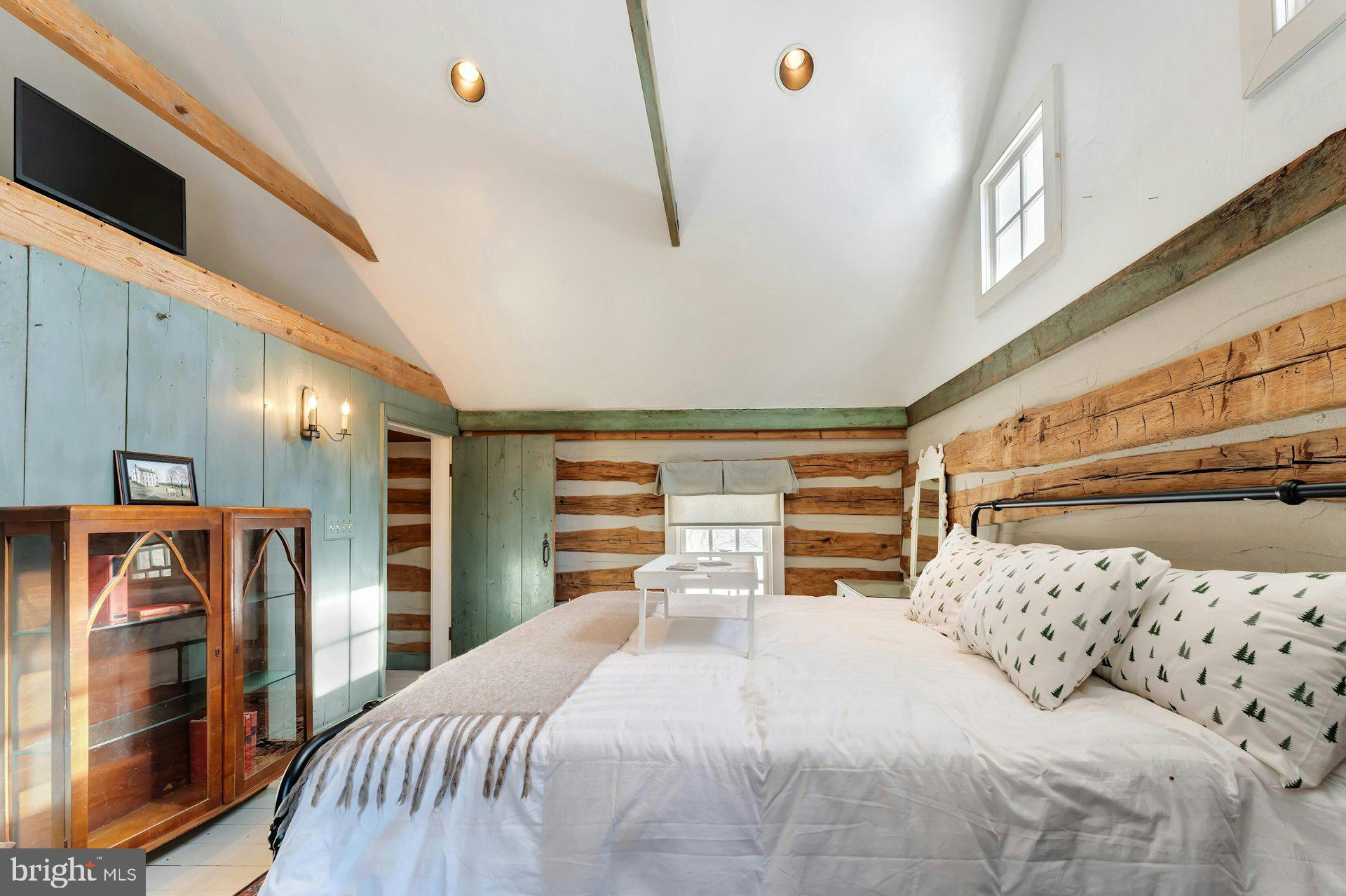 43470 Evans Pond Road Leesburg, VA 20176 - Photo 61 of 114 a bedroom with a large bed and a flat tv screen on dresser