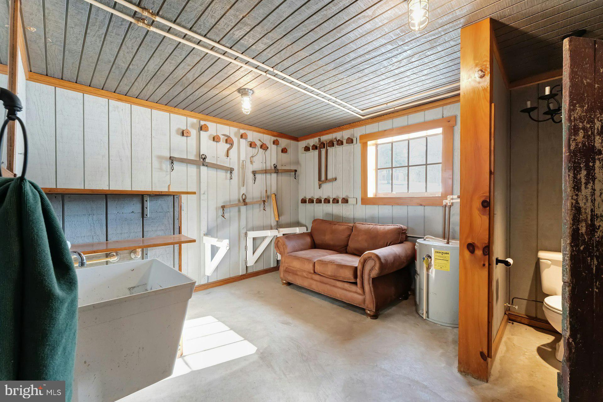 43470 Evans Pond Road Leesburg, VA 20176 - Photo 73 of 114 a living room with furniture a flat screen tv and next to a window