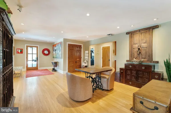 a large kitchen with stainless steel appliances granite countertop a stove and a sink