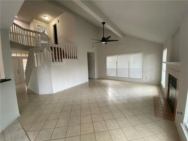 a view of an empty room and a fireplace