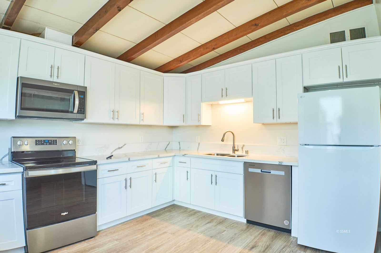 333 North Florence Street Ridgecrest, CA 93555 - Photo 13 of 30 a kitchen with a sink a stove and refrigerator