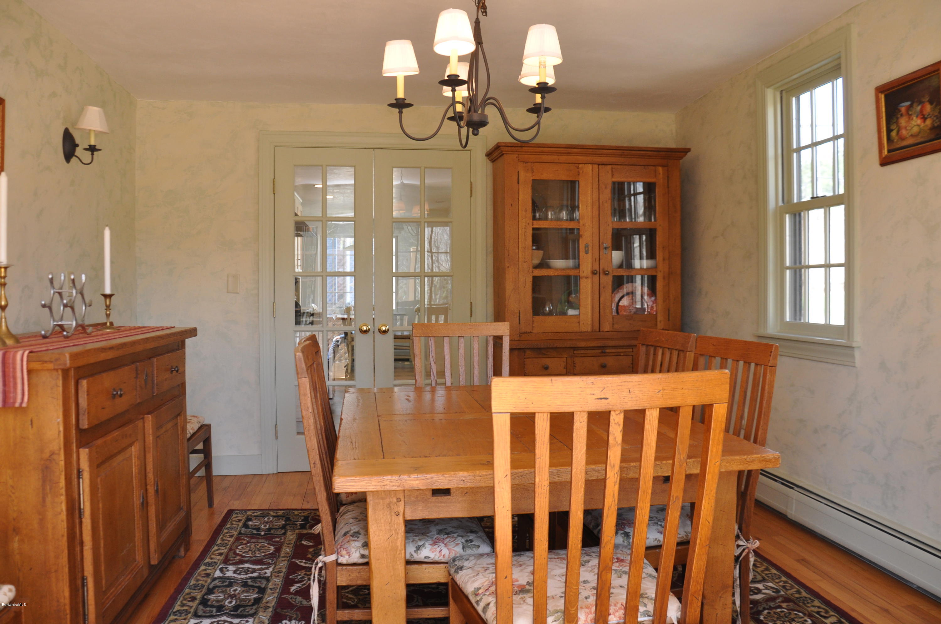 210 Main Road Monterey, MA 01245 - Photo 2 of 33 a dining room with wooden floor fan and windows
