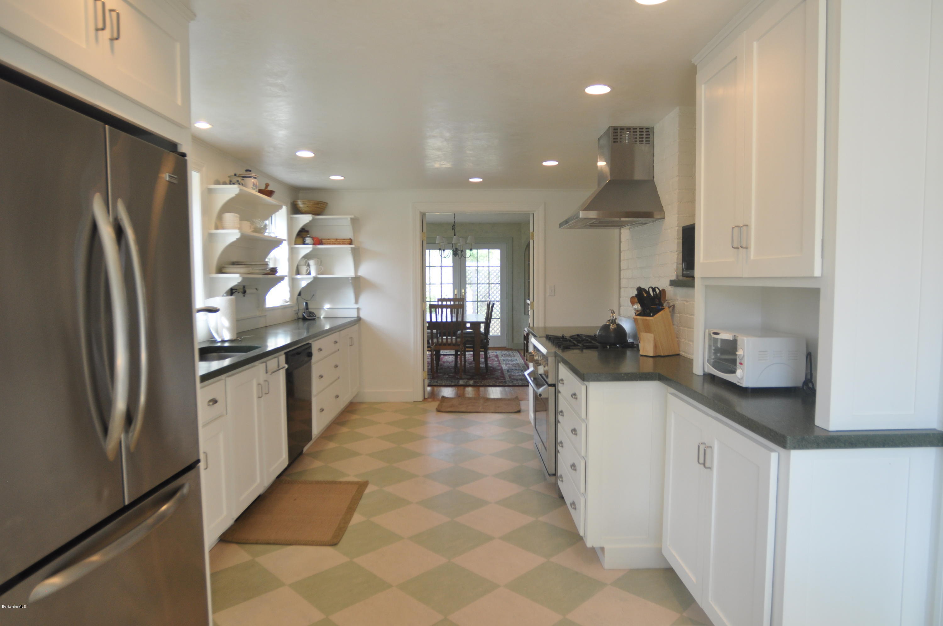 210 Main Road Monterey, MA 01245 - Photo 17 of 33 a kitchen with stainless steel appliances granite countertop a refrigerator and a sink