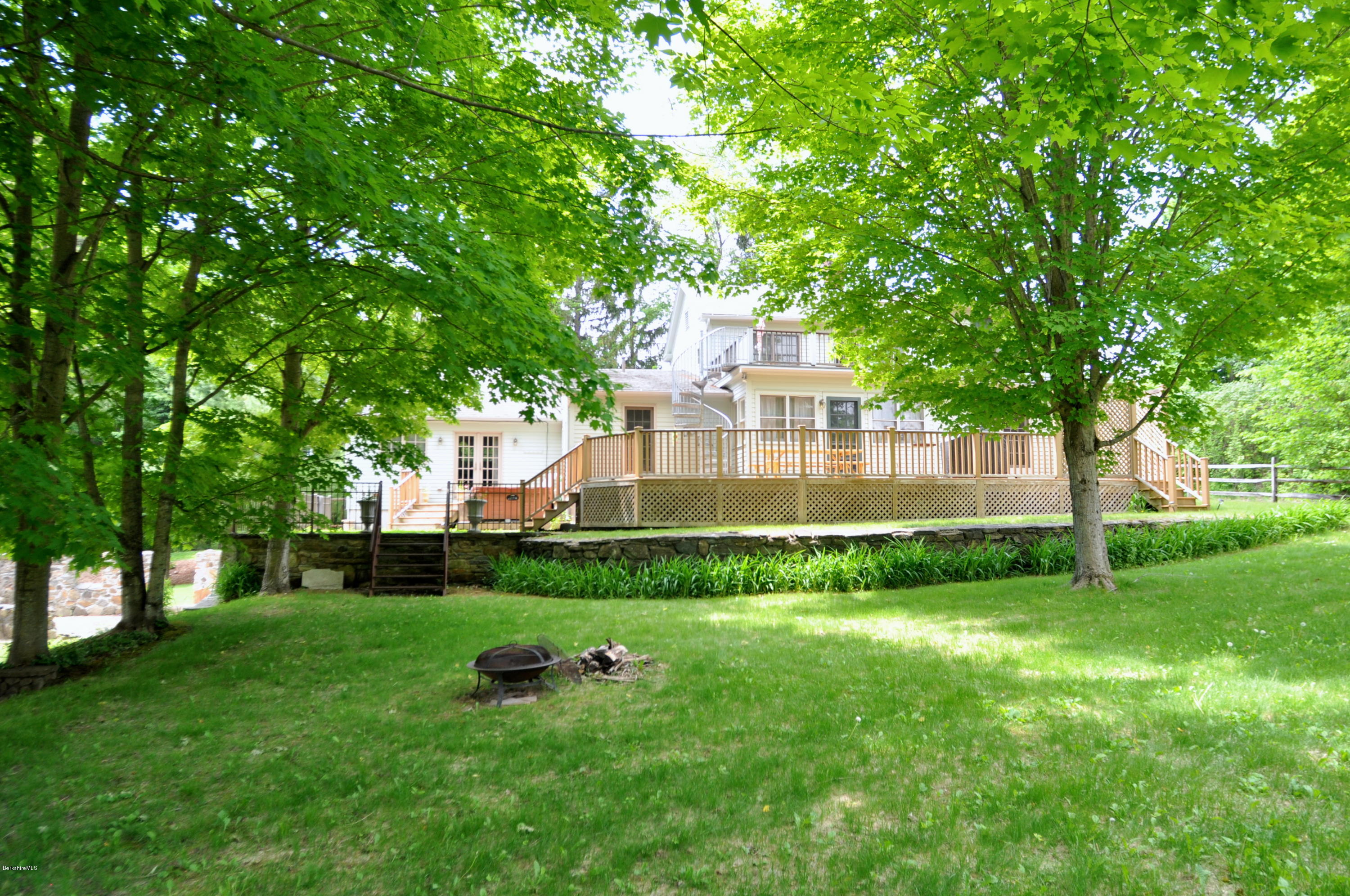 210 Main Road Monterey, MA 01245 - Photo 20 of 33 a view of a house with backyard and a tree
