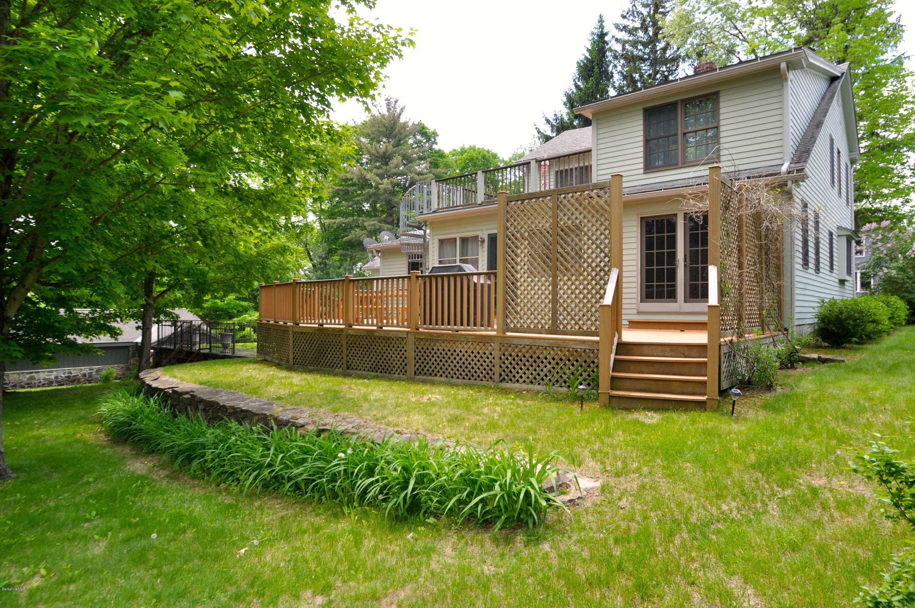 210 Main Road Monterey, MA 01245 - Photo 21 of 33 a view of a house with a yard
