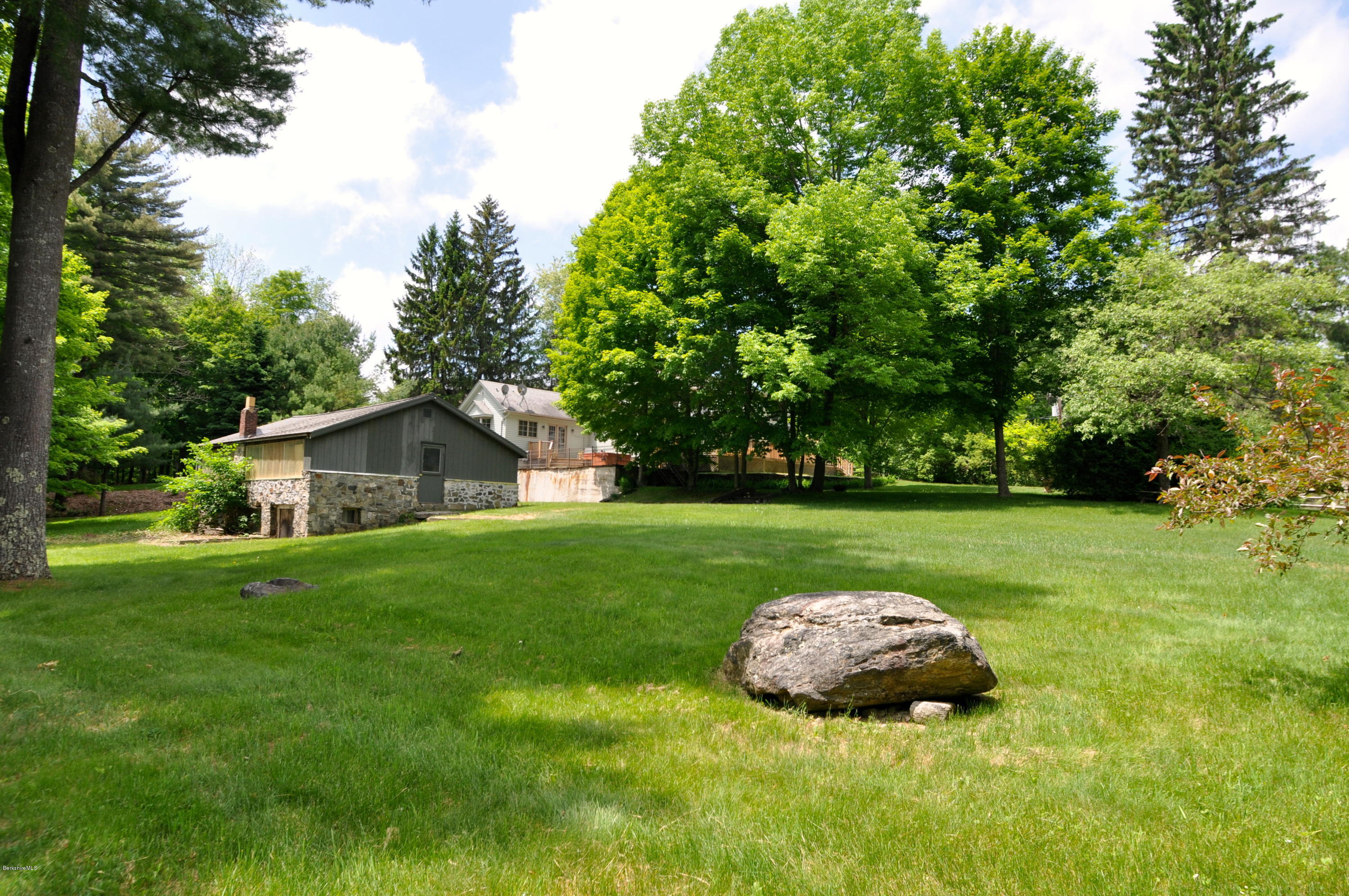 210 Main Road Monterey, MA 01245 - Photo 23 of 33 a view of a house with a backyard