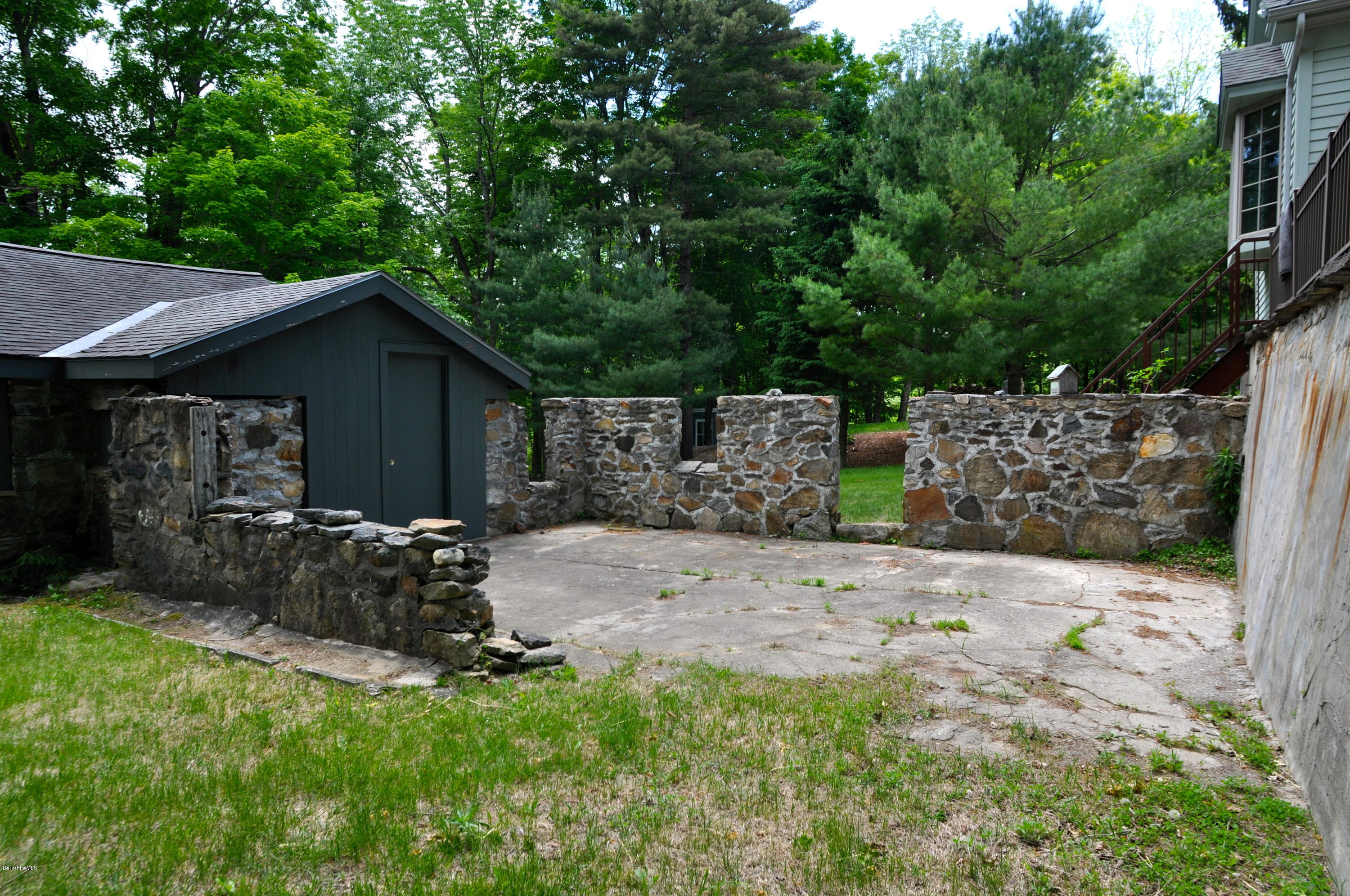 210 Main Road Monterey, MA 01245 - Photo 30 of 33 a front view of a house with garden