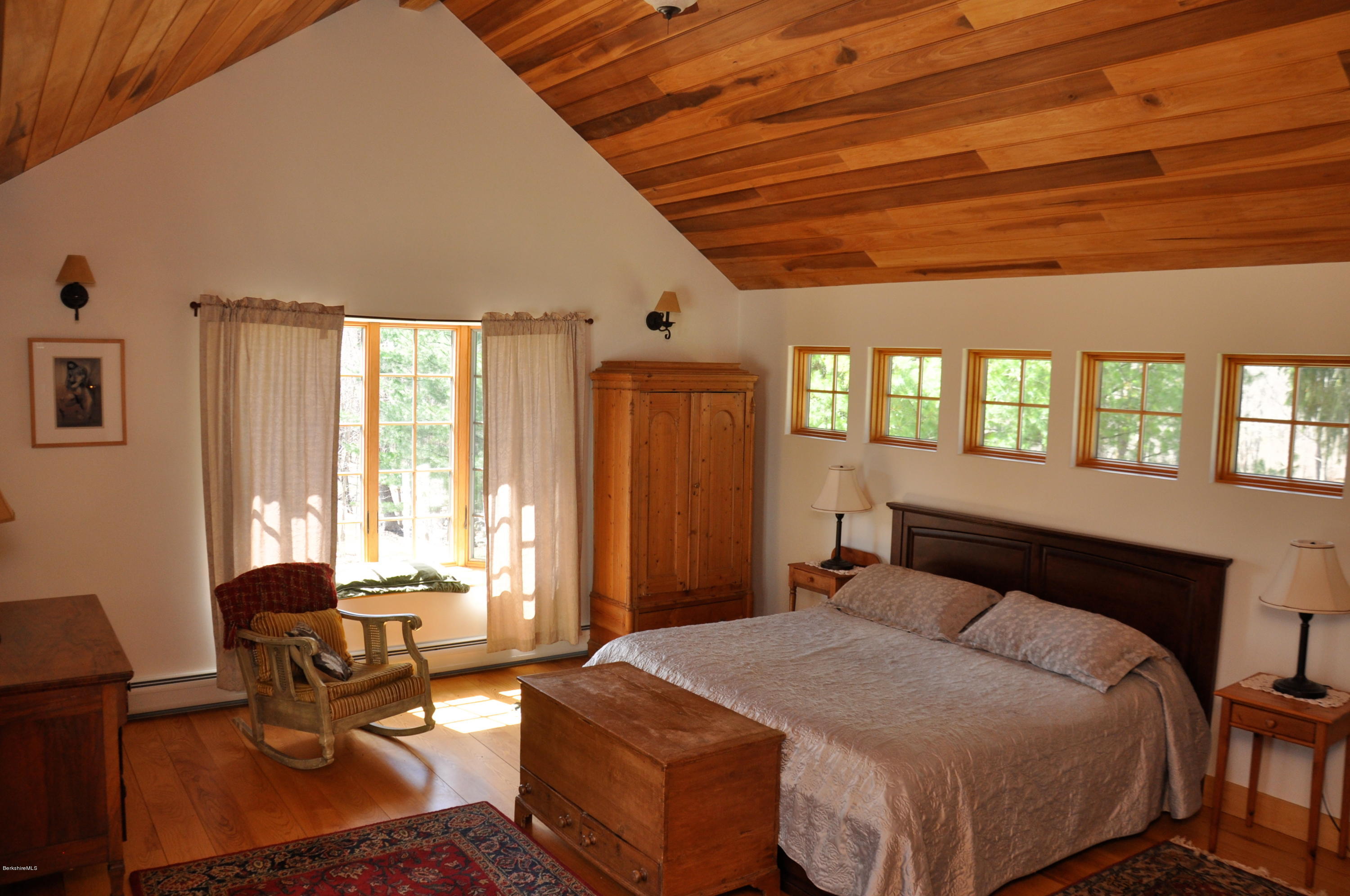 210 Main Road Monterey, MA 01245 - Photo 4 of 33 a bedroom with a bed and wooden floor
