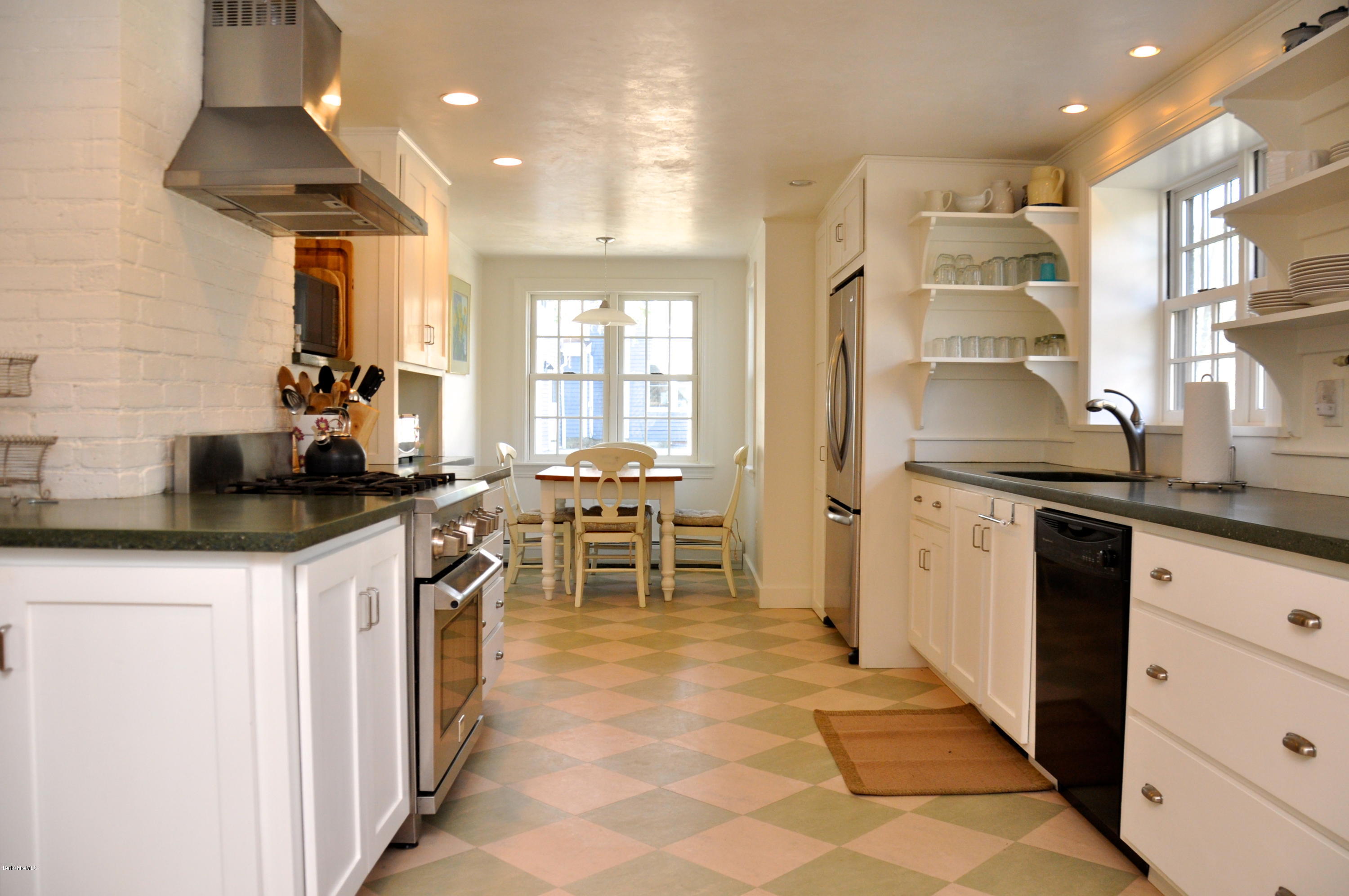 210 Main Road Monterey, MA 01245 - Photo 32 of 33 a kitchen with stainless steel appliances kitchen island granite countertop a sink and cabinets
