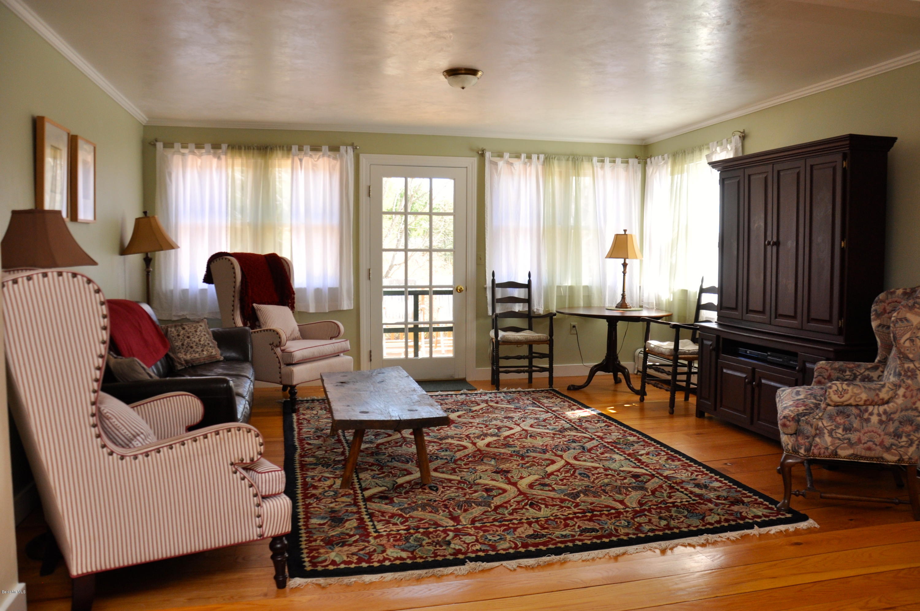 210 Main Road Monterey, MA 01245 - Photo 5 of 33 a living room with furniture and wooden floor