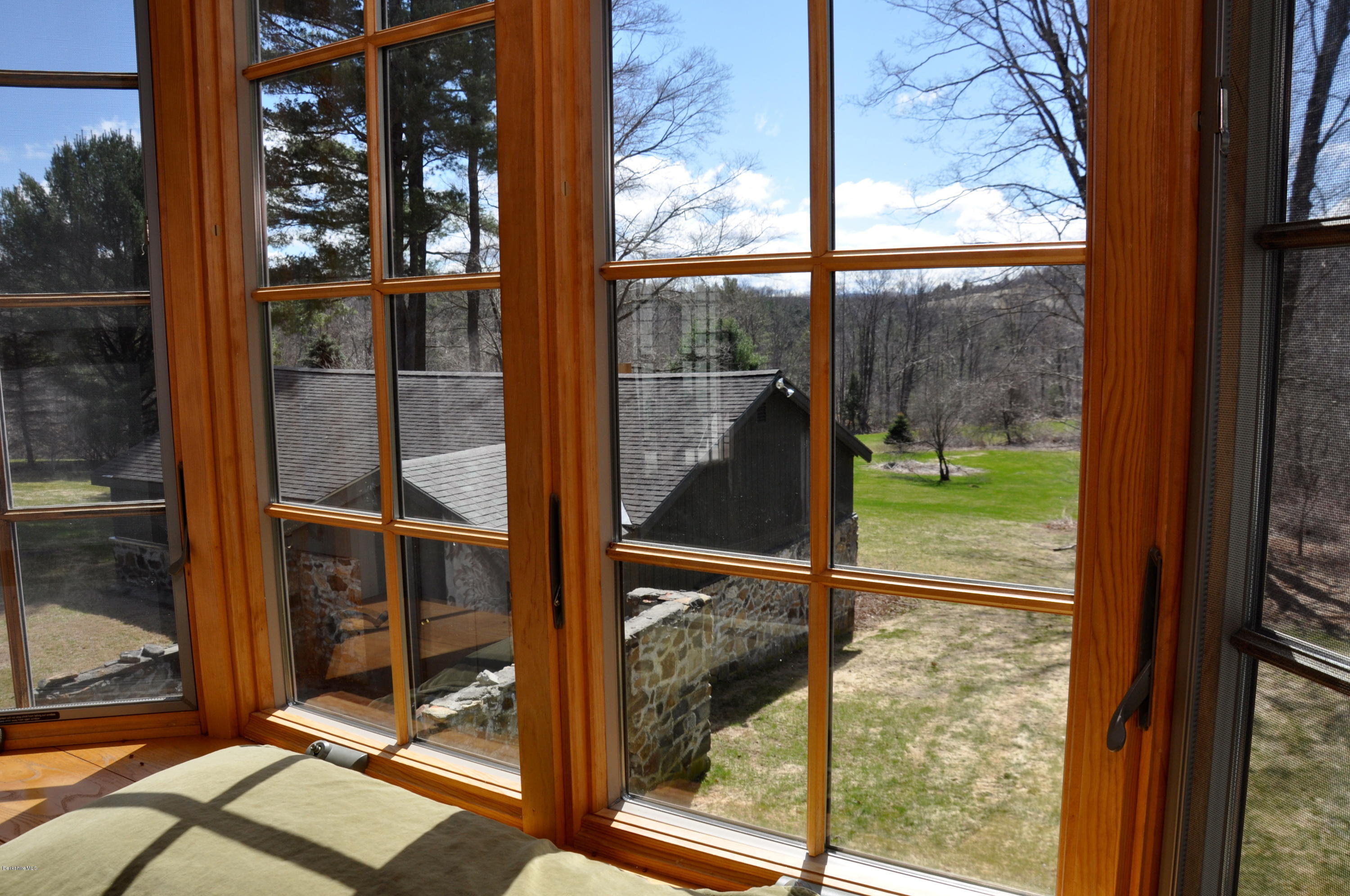 210 Main Road Monterey, MA 01245 - Photo 9 of 33 a view of a glass door with a yard from a window