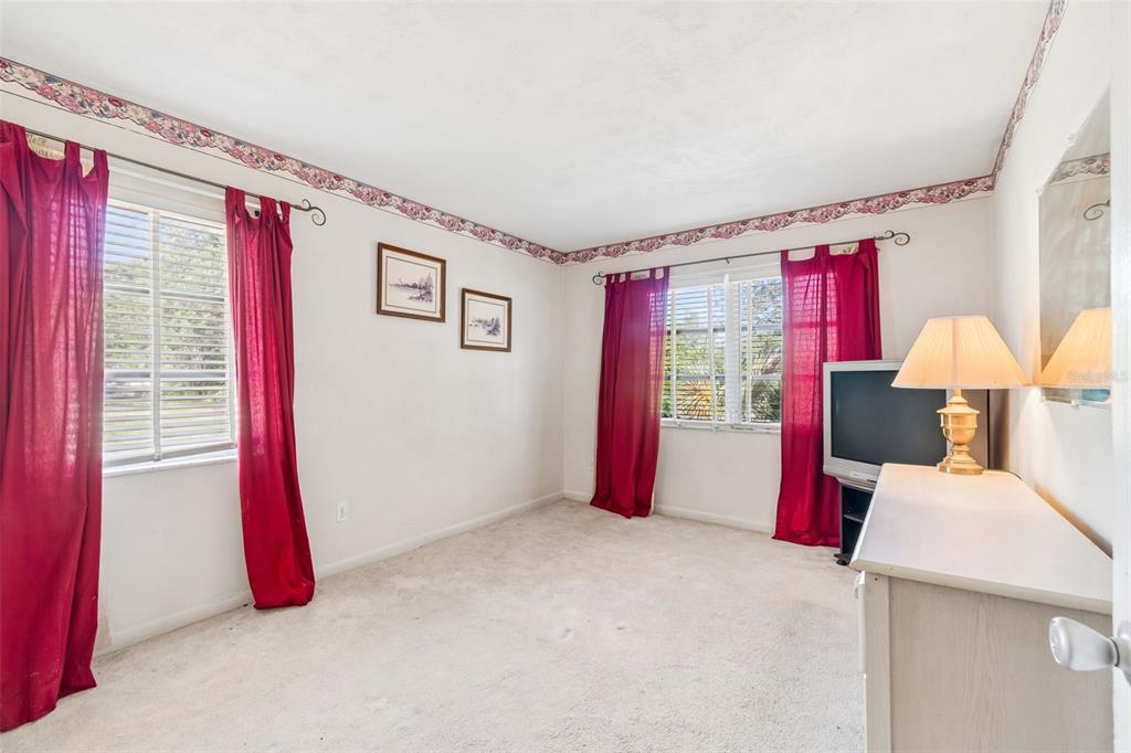 2059 Waterfall Drive Spring Hill, FL 34608 - Photo 15 of 26 a bed room with a bed and a window