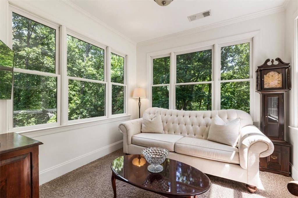 3910 Two Rivers Drive Cumming, GA 30041 - Photo 46 of 110 a living room with furniture and a large window
