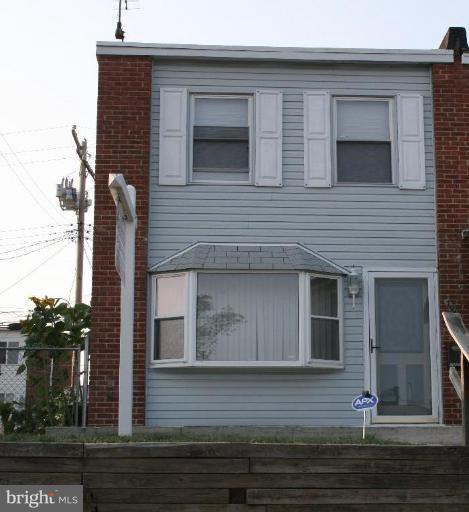 7936 Wynbrook Road Baltimore, MD 21224 - Photo 1 of 1 a front view of a house with garage
