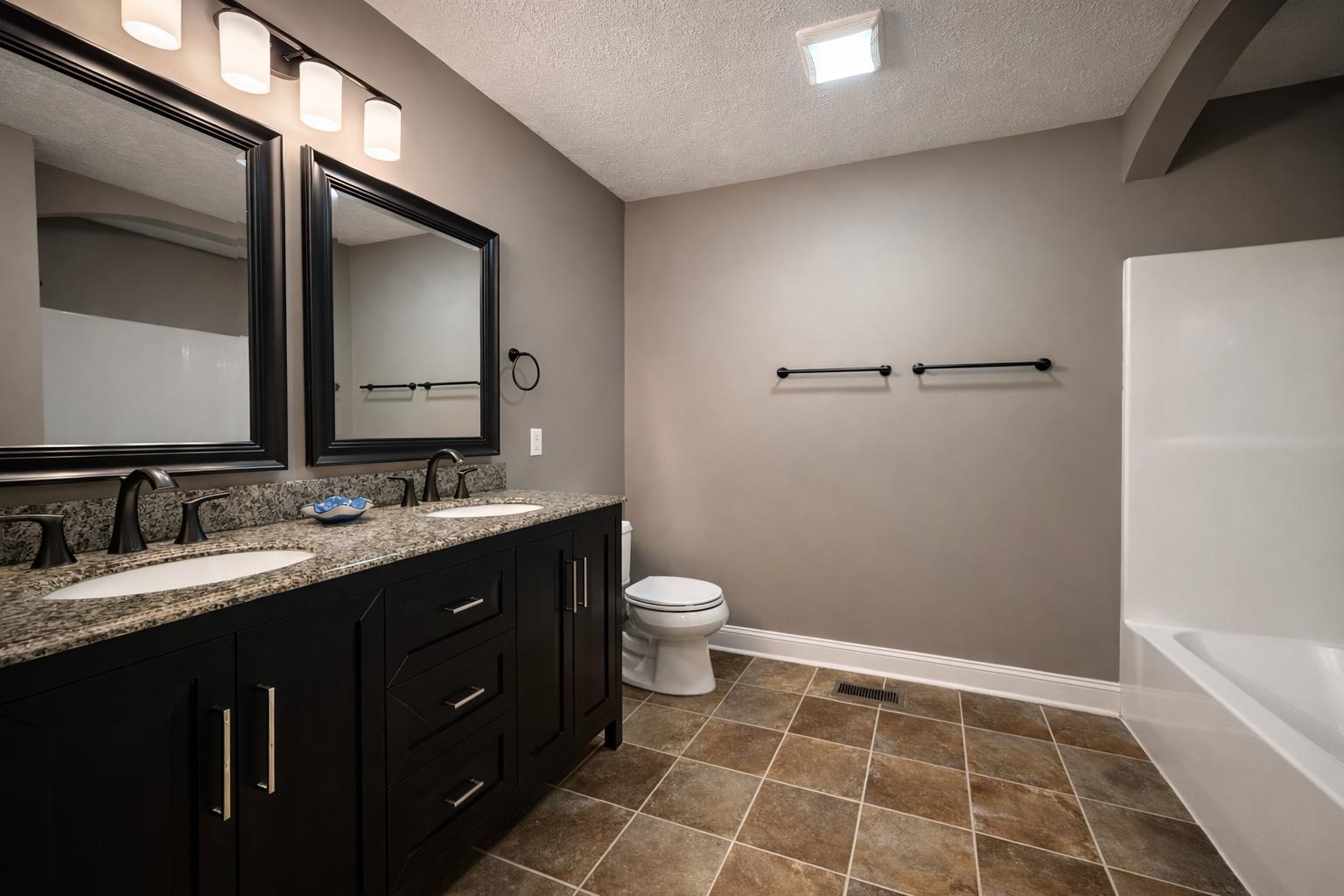60 Masters Court Counce, TN 38326 - Photo 12 of 30 Bathroom with double vanity and a textured ceiling