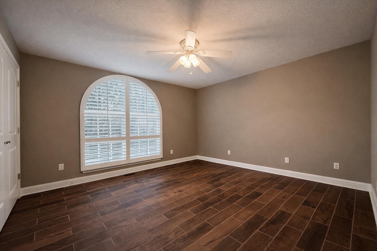 60 Masters Court Counce, TN 38326 - Photo 13 of 30 Empty room with wood tiled floors, a textured ceiling, and ceiling fan