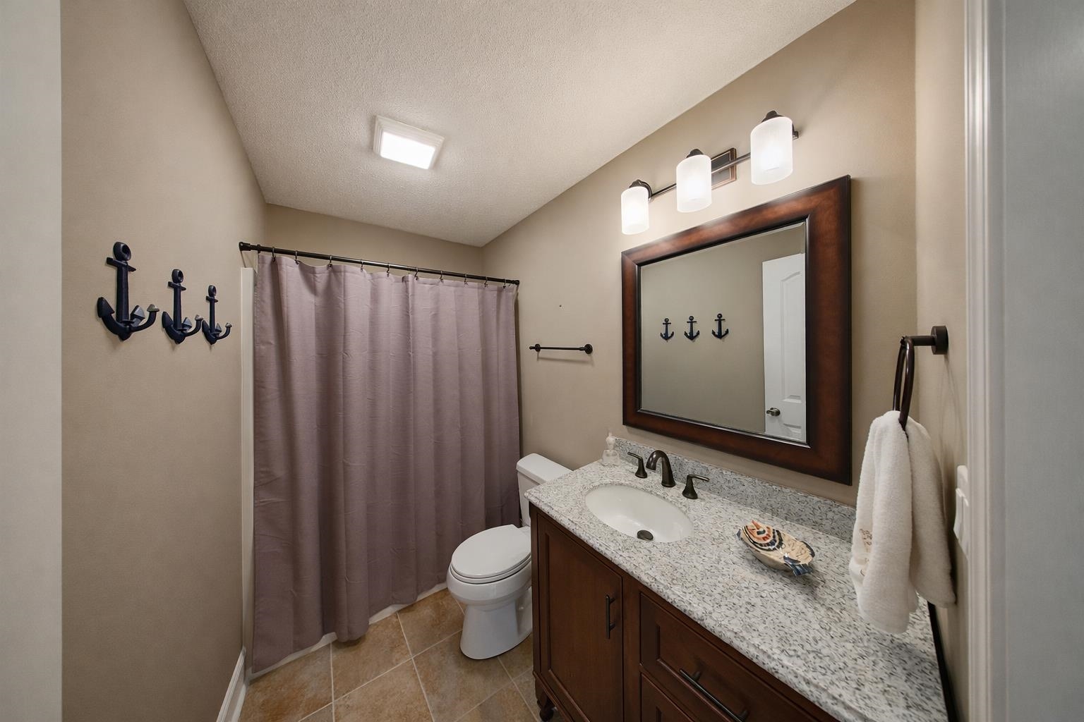 60 Masters Court Counce, TN 38326 - Photo 14 of 30 Bathroom featuring vanity, a shower with curtain, a textured ceiling, and light tile patterned flooring