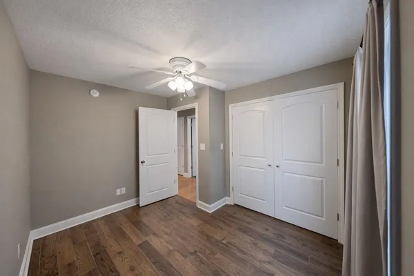 a view of a house with backyard sitting area and garden