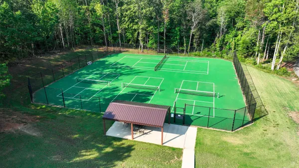 a view of a backyard with a patio