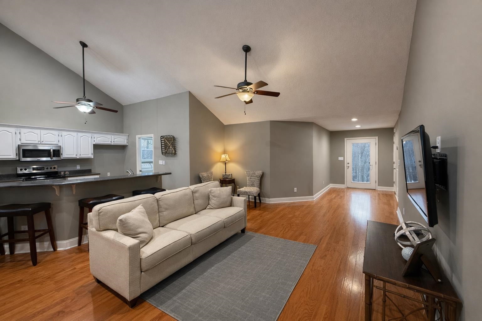 60 Masters Court Counce, TN 38326 - Photo 3 of 30 Living room featuring light wood-type flooring, ceiling fan, and vaulted ceiling