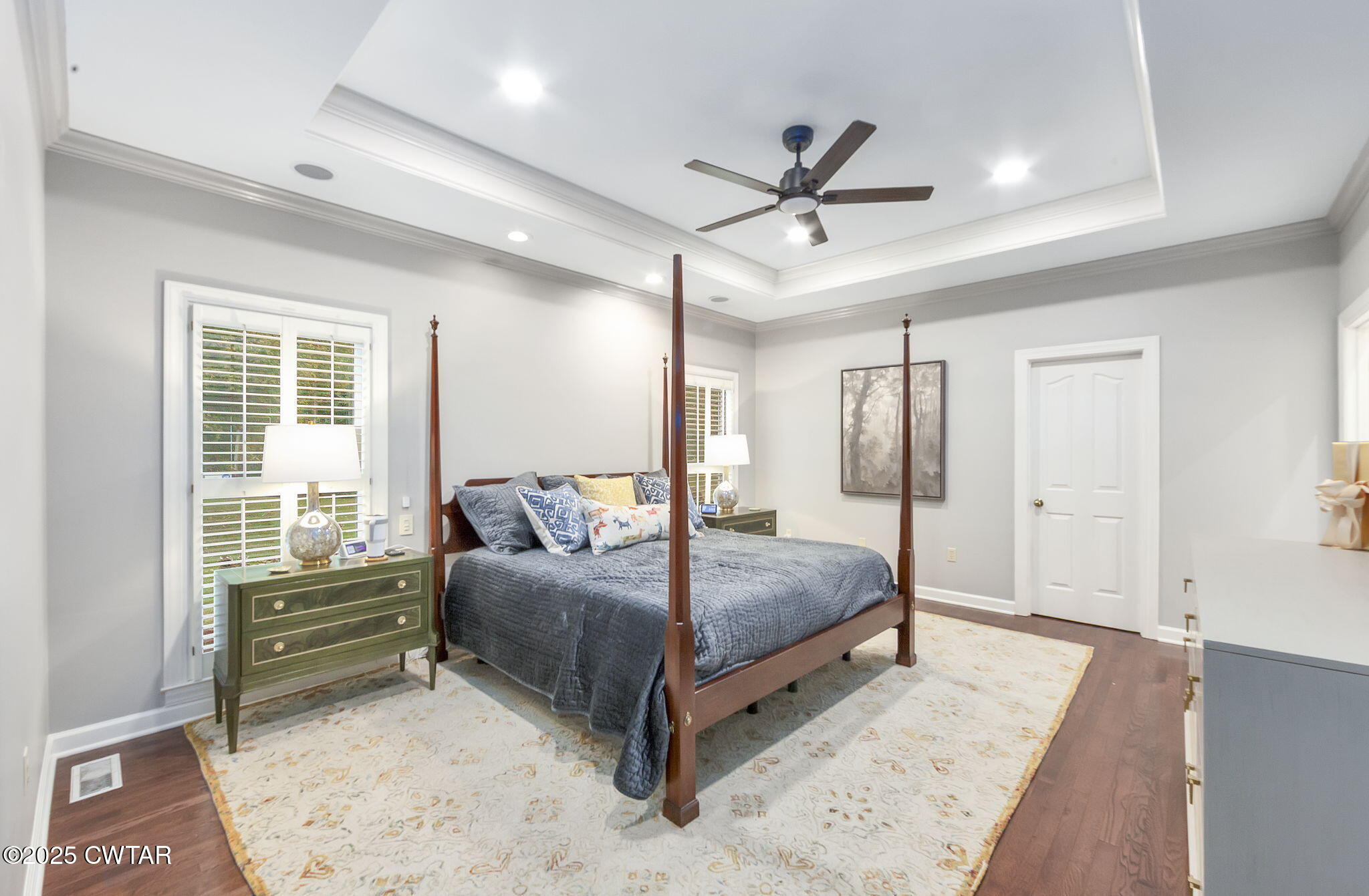 119 Bascom Road Jackson, TN 38305 - Photo 15 of 49 a bedroom with a large bed and a chandelier