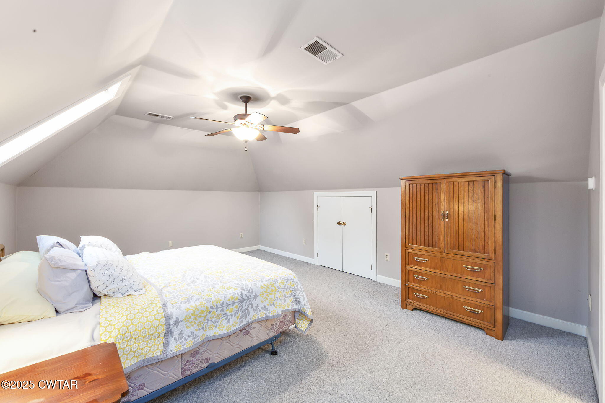 119 Bascom Road Jackson, TN 38305 - Photo 28 of 49 a bedroom with a bed and a cabinets