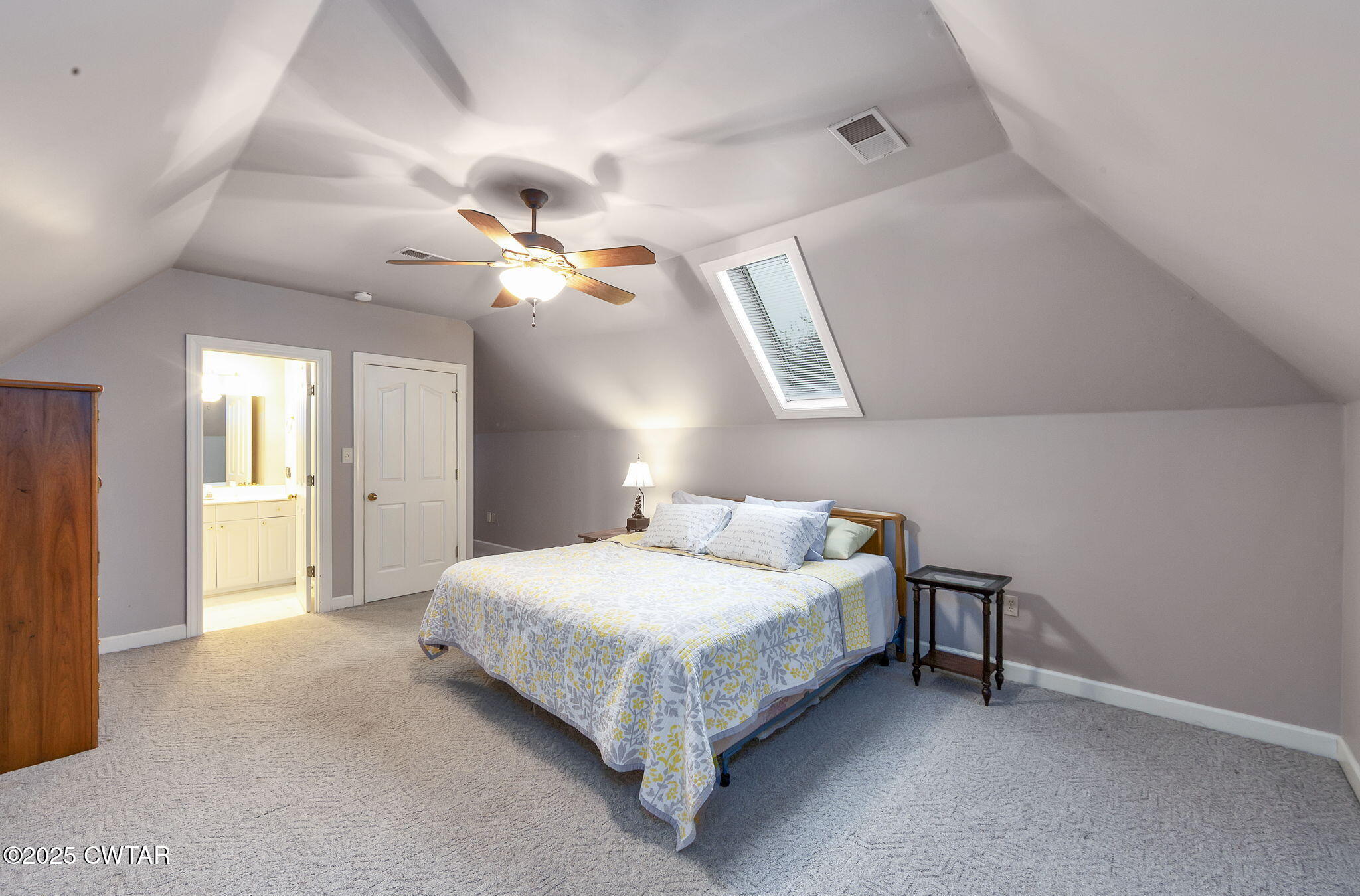 119 Bascom Road Jackson, TN 38305 - Photo 29 of 49 a bedroom with a bed and a chandelier