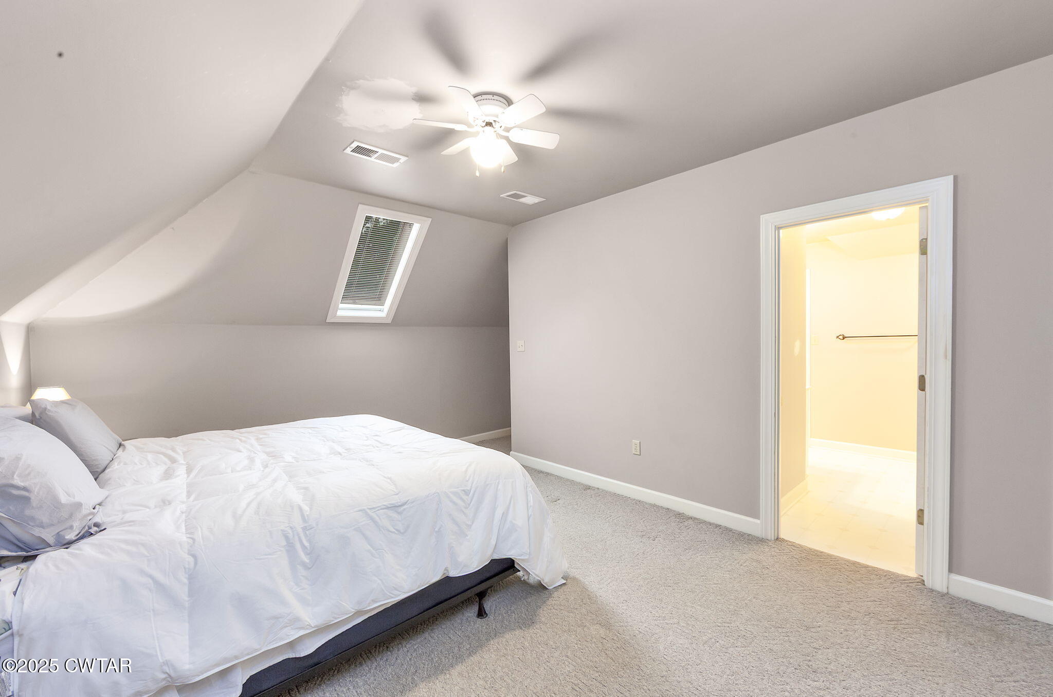 119 Bascom Road Jackson, TN 38305 - Photo 30 of 49 a bedroom with a bed and a chandelier