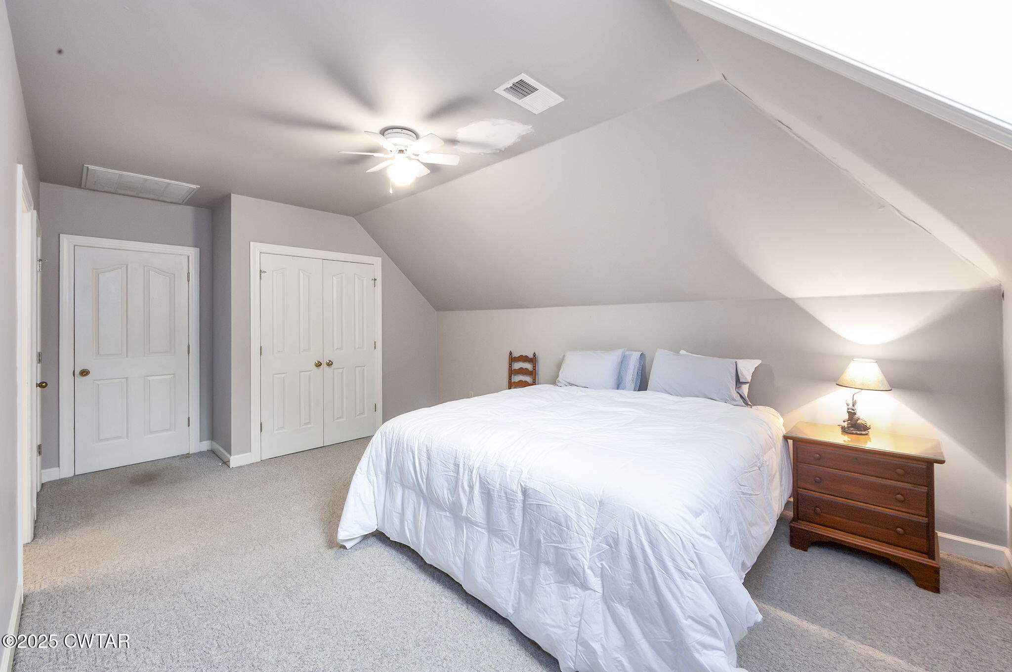 119 Bascom Road Jackson, TN 38305 - Photo 31 of 49 a bedroom with a bed and a chandelier