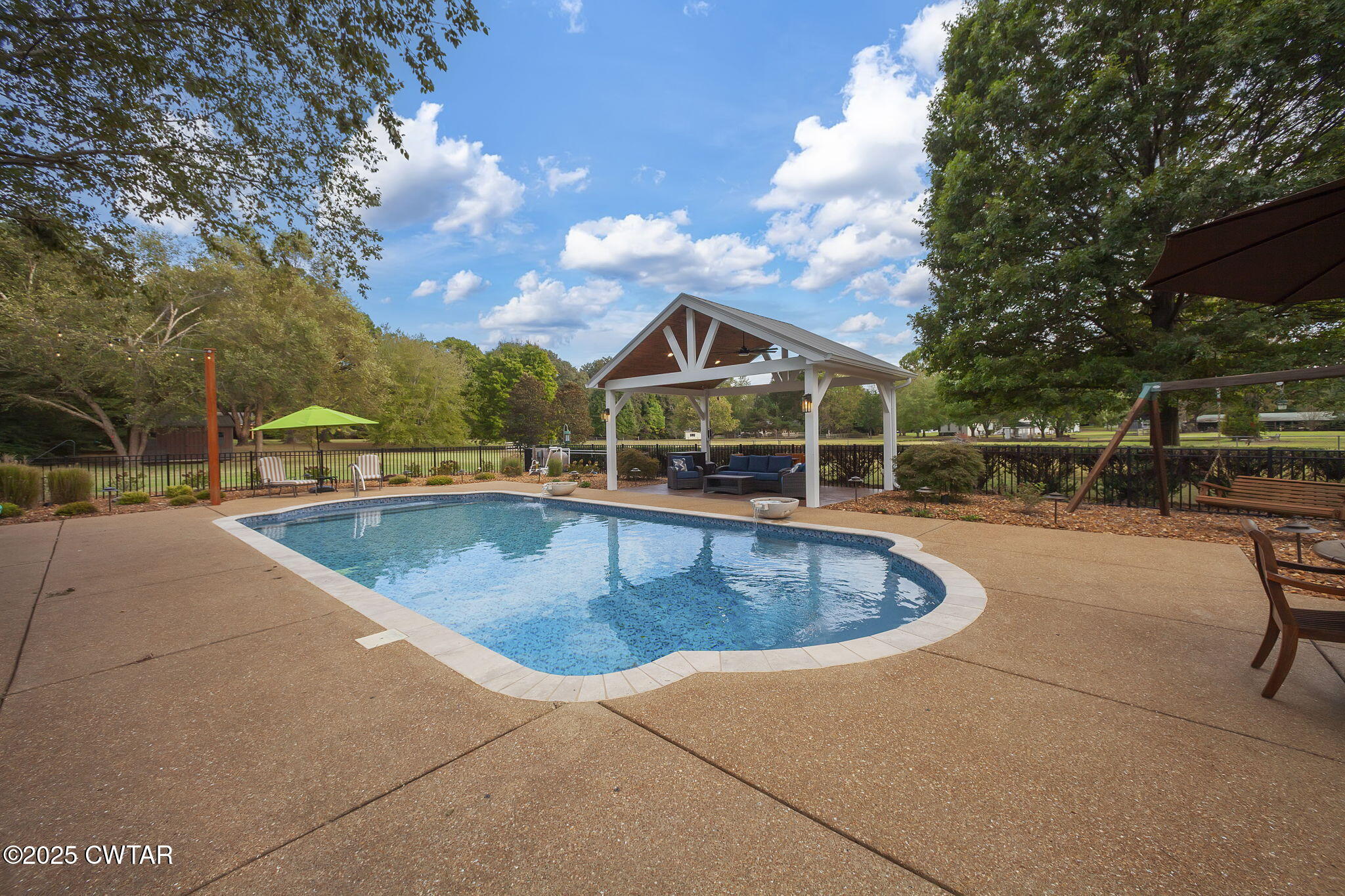 119 Bascom Road Jackson, TN 38305 - Photo 34 of 49 a view of a swimming pool with an outdoor seating