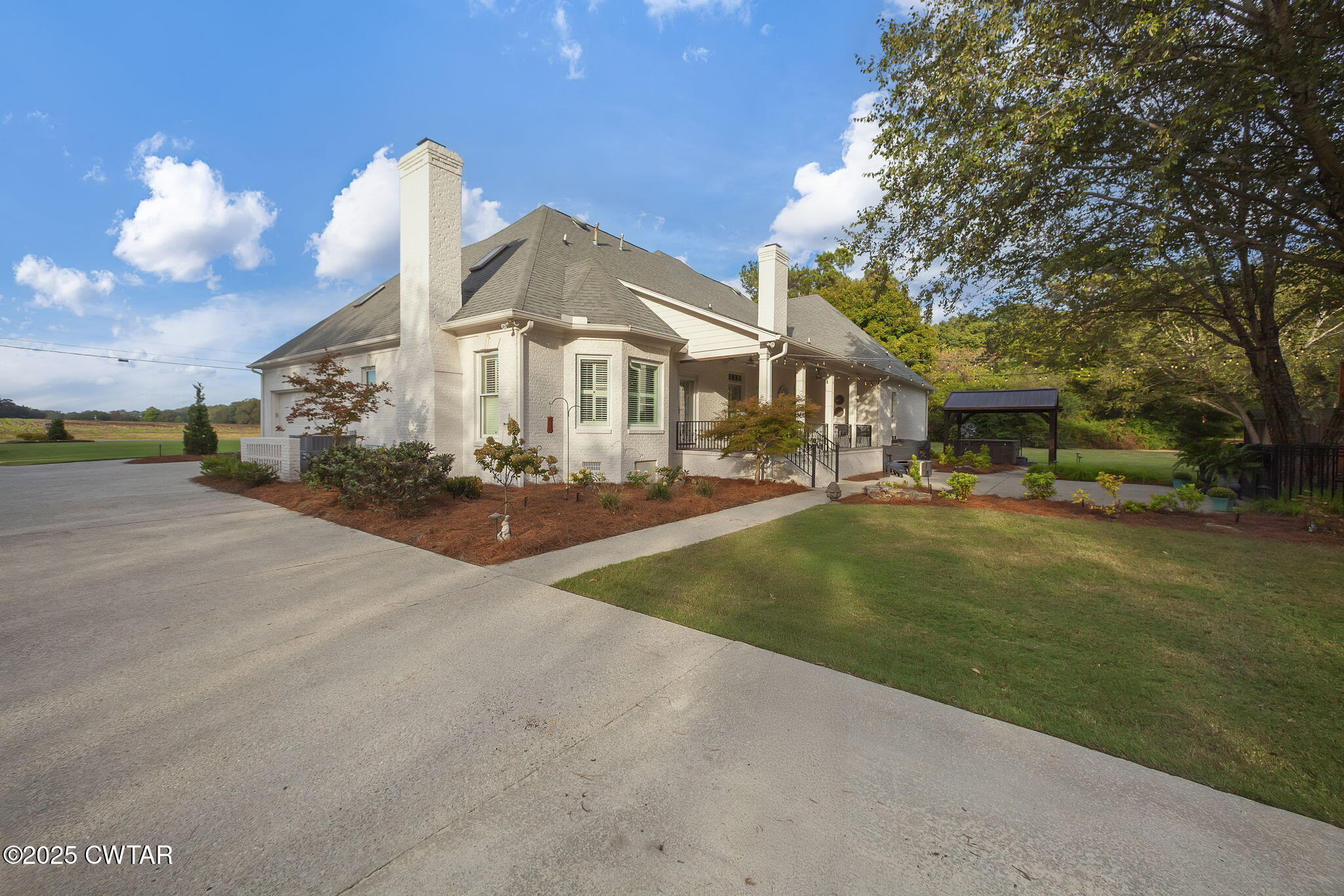 119 Bascom Road Jackson, TN 38305 - Photo 40 of 49 a front view of a house with a garden and plants