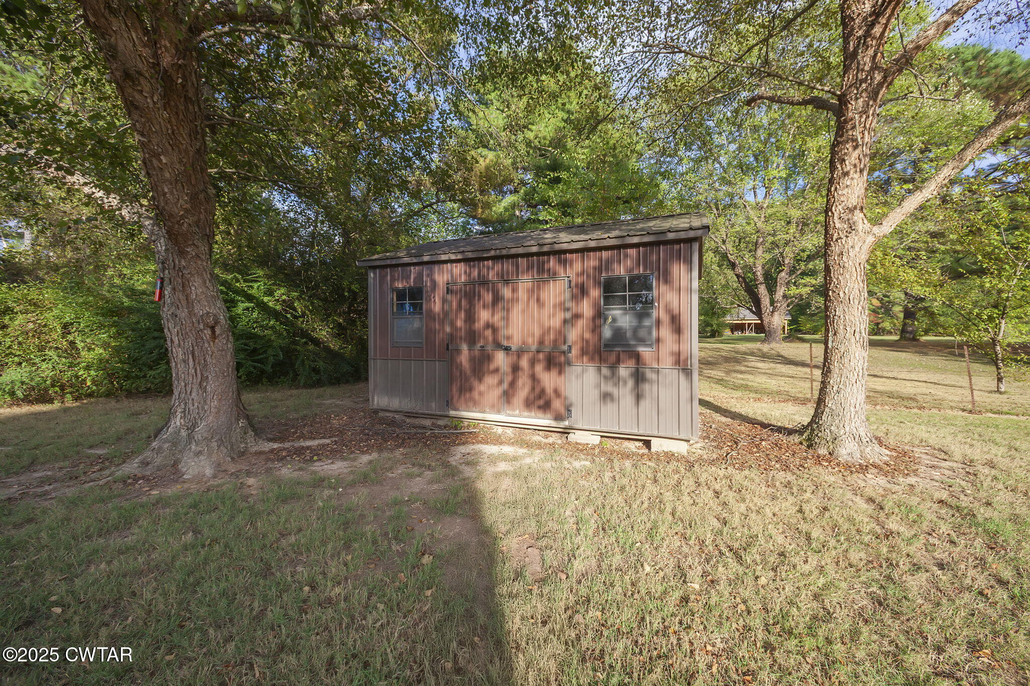 119 Bascom Road Jackson, TN 38305 - Photo 45 of 49 a backyard of a house with lots of green space