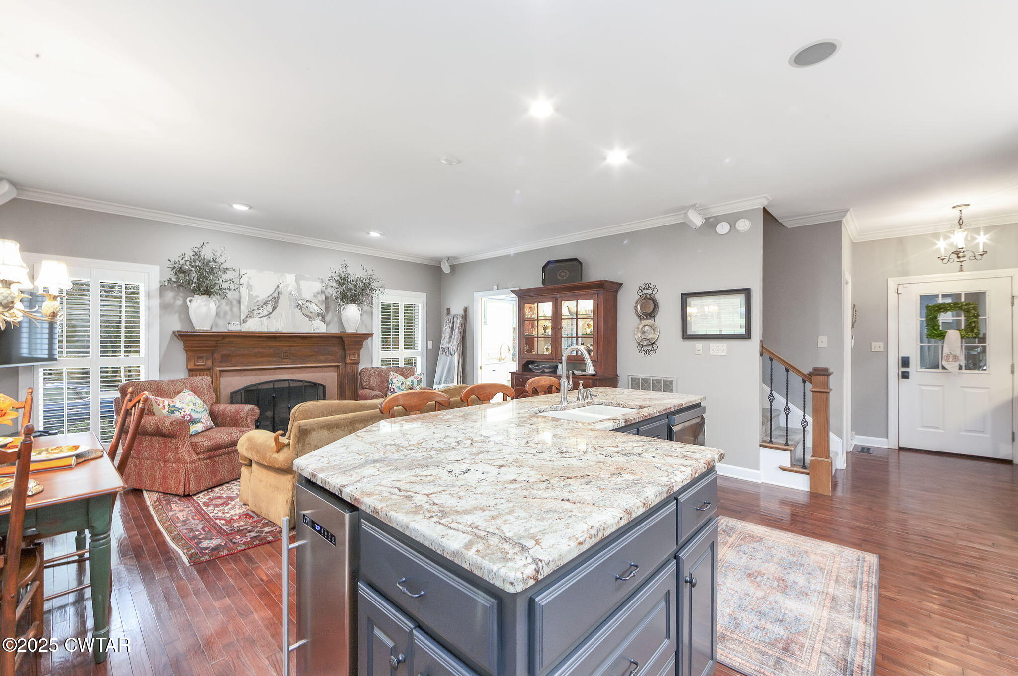119 Bascom Road Jackson, TN 38305 - Photo 9 of 49 a living room with dining table and wooden floor